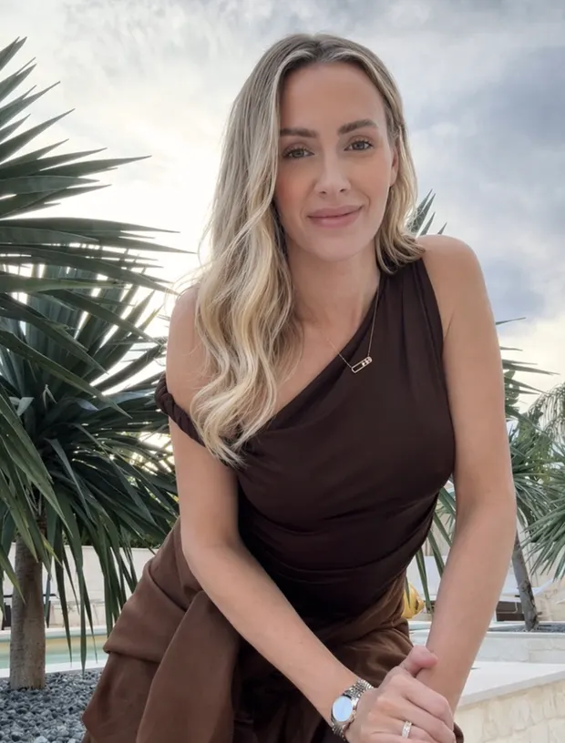 Jessica Rae Saleh at the Sheikh Zayed Grand Mosque in Abu Dhabi, dressed in white and gold